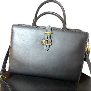 Coach Serra Satchel in black and oxblood leather.